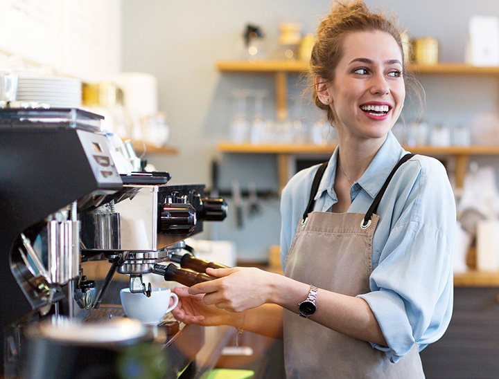 Image of person working in a coffee shop.
